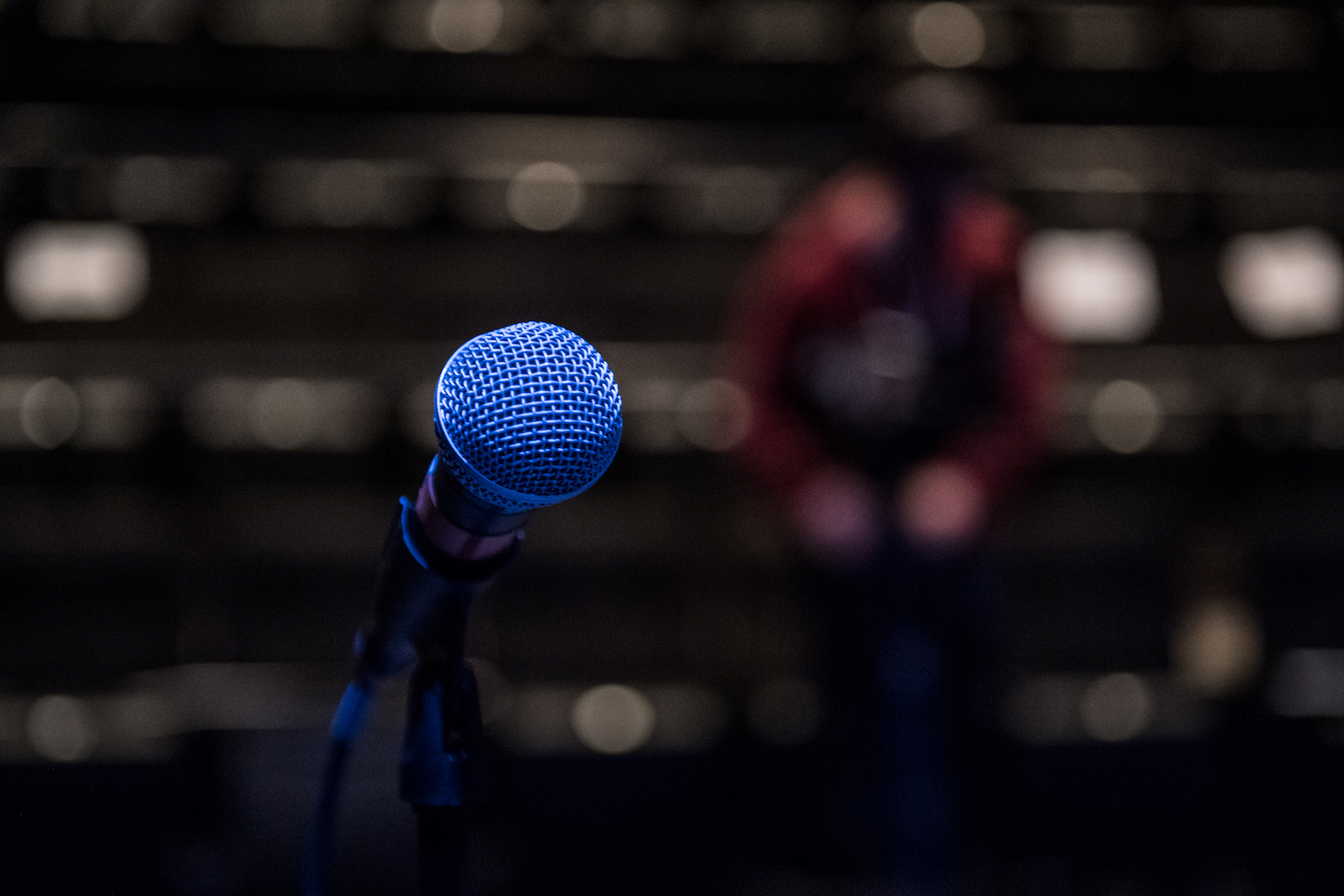 microphone with an audience in the background
